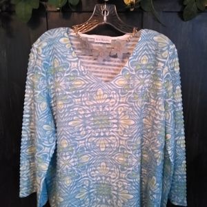 Kim Rogers floral blouse with necklace